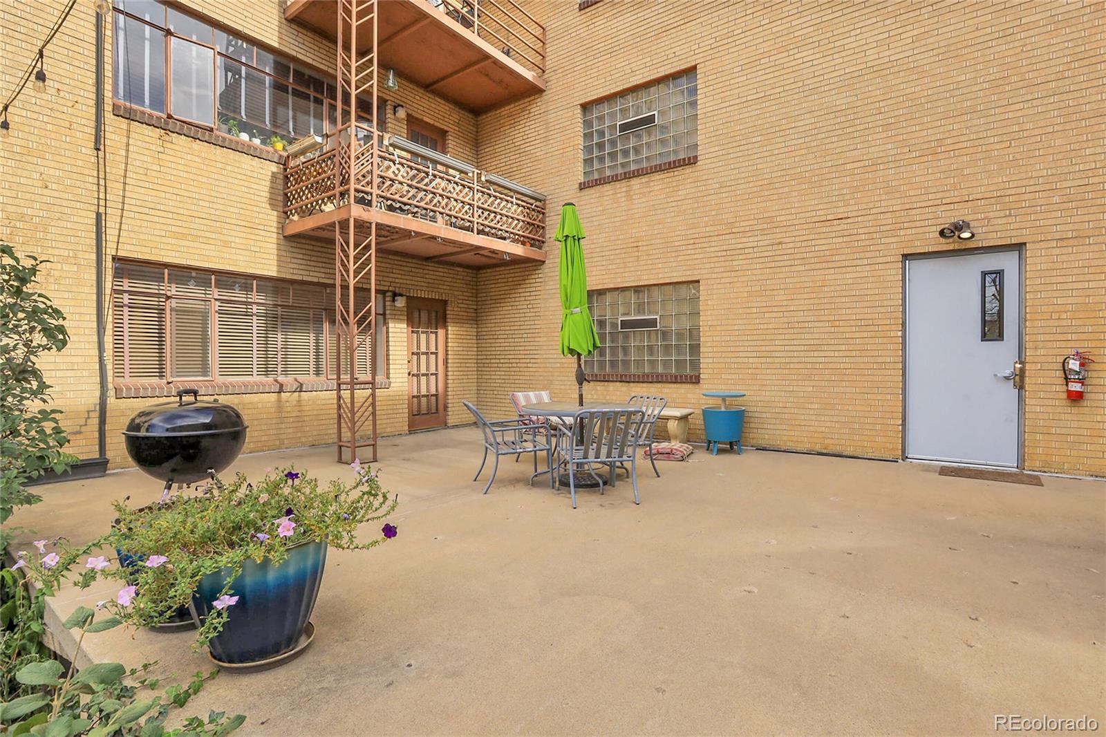 1175 Emerson Street, Unit 202 Denver, CO 80218 - Photo 27 of 31 a view of a chairs with a potted plant