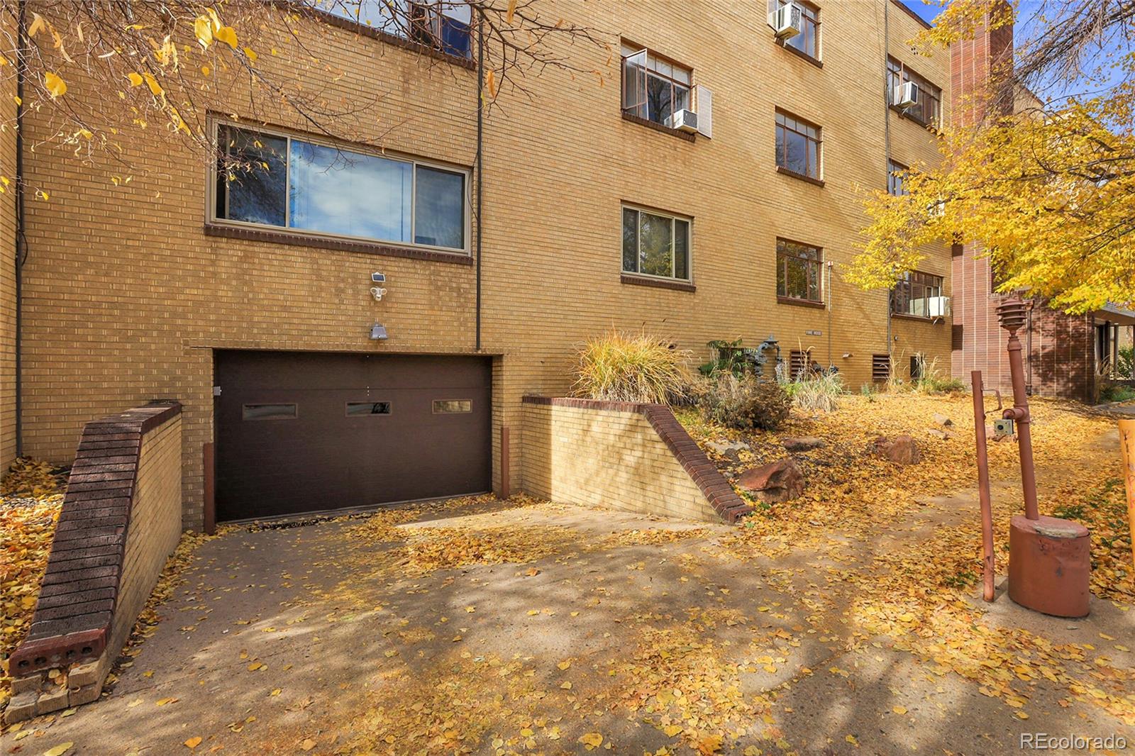 1175 Emerson Street, Unit 202 Denver, CO 80218 - Photo 4 of 31 a view of a house with a yard
