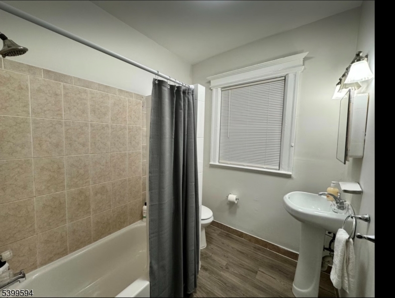 854 South 15th Street, Unit 2 Newark, NJ 07108 - Photo 9 of 9 a bathroom with a sink toilet and shower