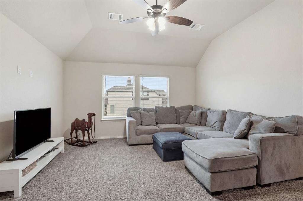 4002 Grove Valley Road Midlothian, TX 76065 - Photo 28 of 40 a living room with furniture and a flat screen tv