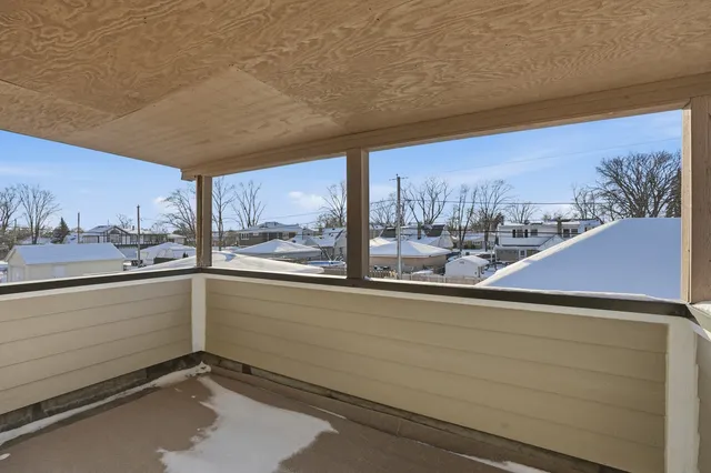 a view of a blue and white roof deck
