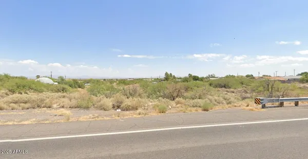 a view of a road with an ocean