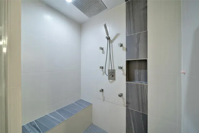 a view of a living room with a floor to ceiling window and a table