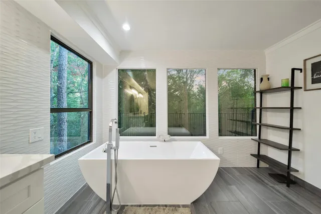 a spacious bathroom with a double vanity sink and a large mirror