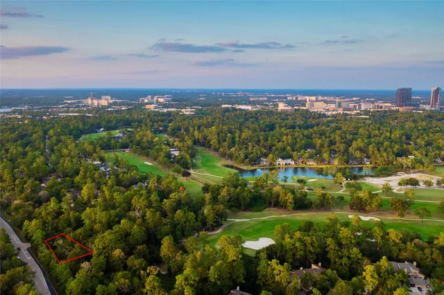 a house that has a tree in front of it