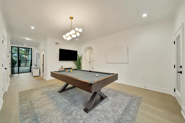 a bedroom with furniture and a large window