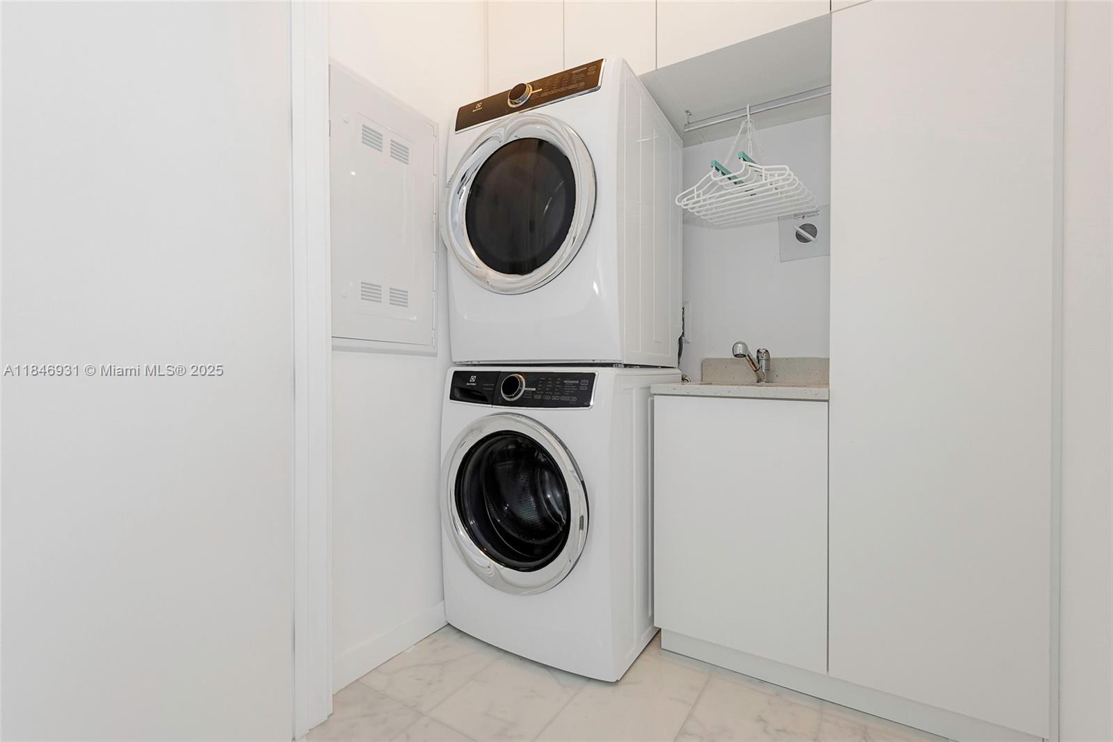 2821 South Bayshore Drive, Unit 7B Coconut Grove, FL 33133 - Photo 24 of 35 a utility room with dryer and washer