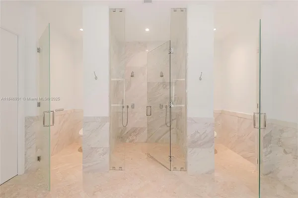 a view of a living room and bathroom