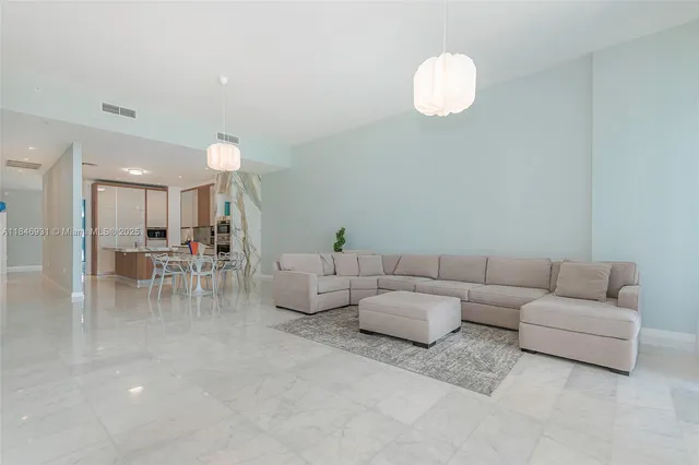 a kitchen with stainless steel appliances kitchen island granite countertop a sink and cabinets