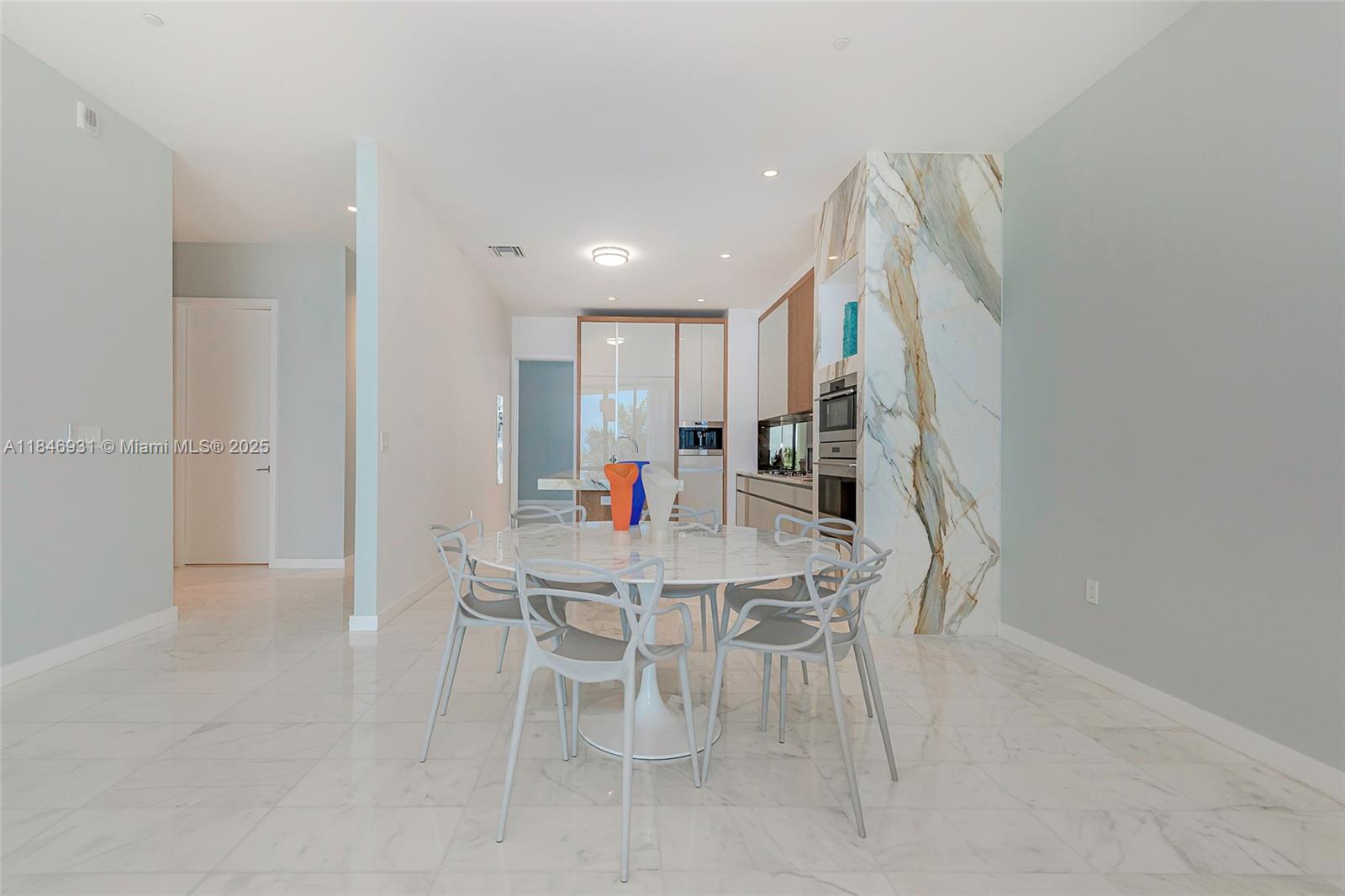 2821 South Bayshore Drive, Unit 7B Coconut Grove, FL 33133 - Photo 8 of 35 a dining room with furniture and window
