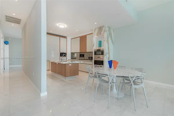 a kitchen with stainless steel appliances a stove sink and microwave