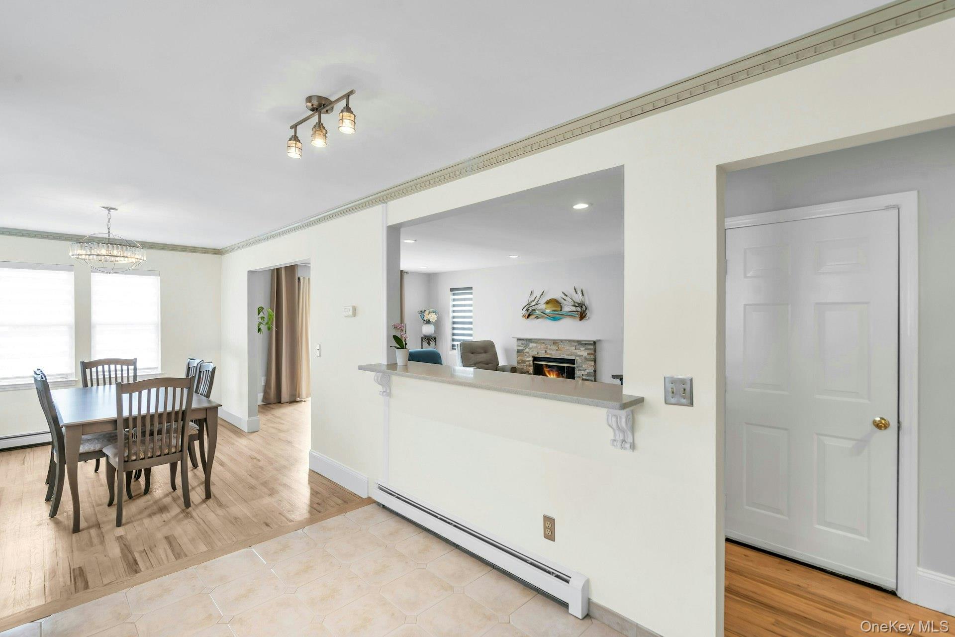 52 Edgewood Road Port Washington, NY 11050 - Photo 14 of 29 a view of a dining room with furniture and wooden floor
