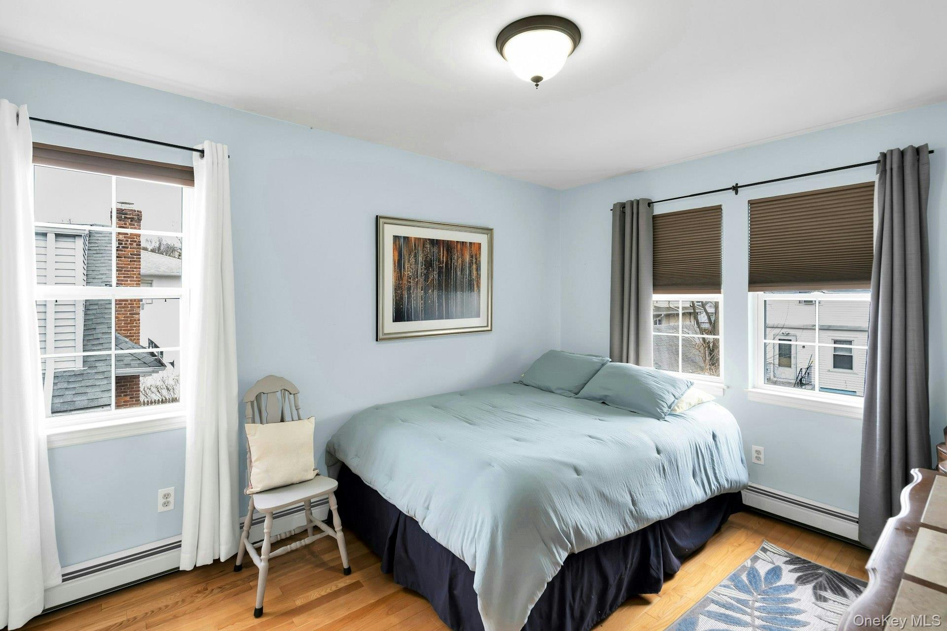 52 Edgewood Road Port Washington, NY 11050 - Photo 19 of 29 a bedroom with a bed and a window