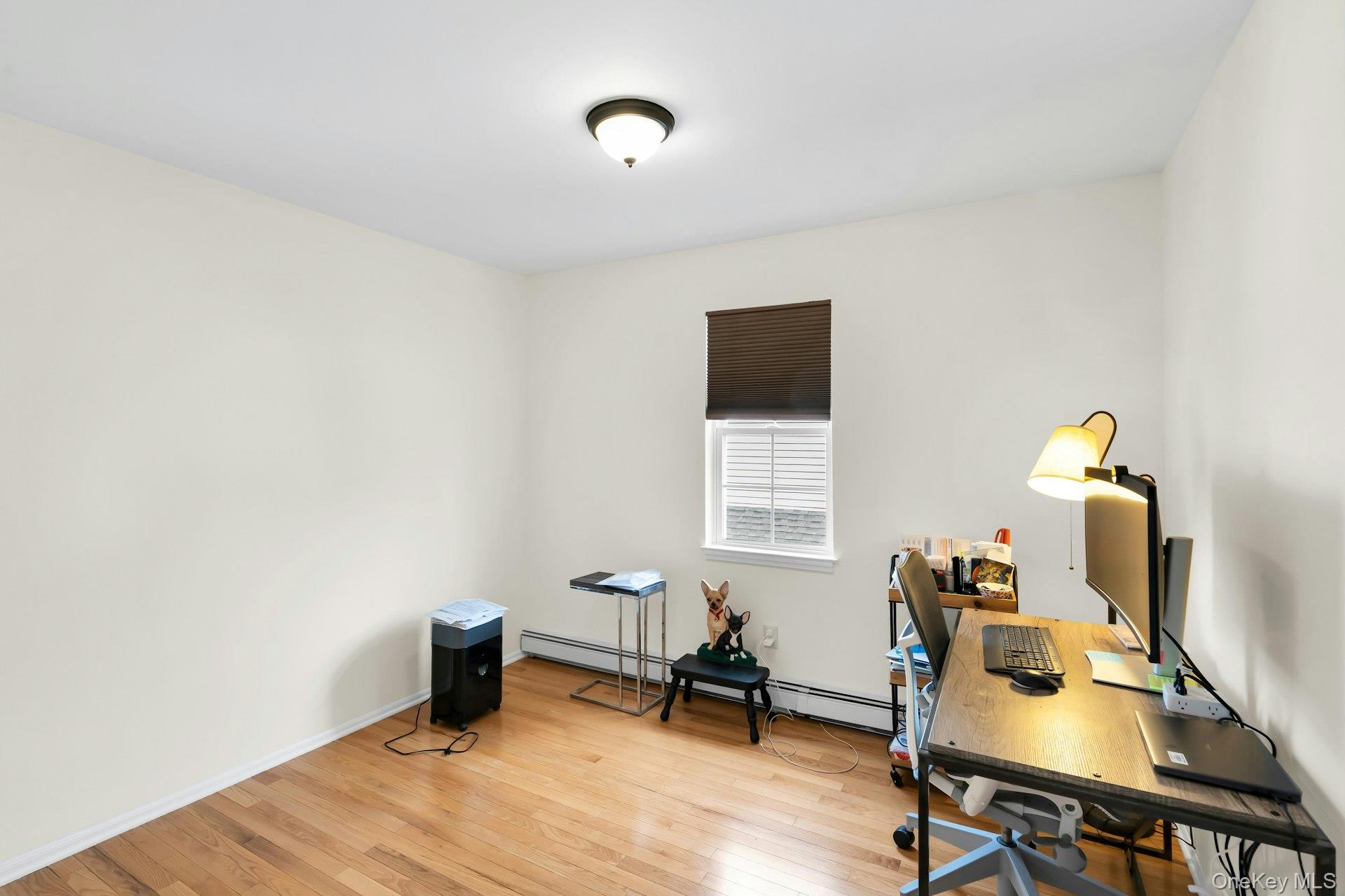 52 Edgewood Road Port Washington, NY 11050 - Photo 21 of 29 a workspace with furniture and a window