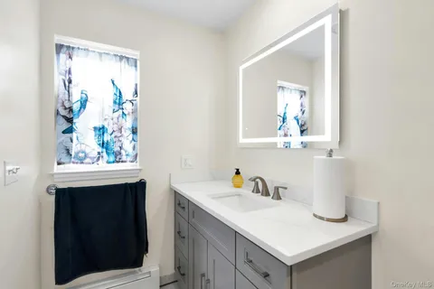 a bathroom with a sink and a mirror
