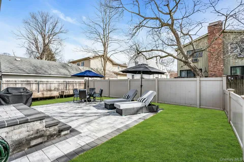 a view of an house with backyard porch and furniture