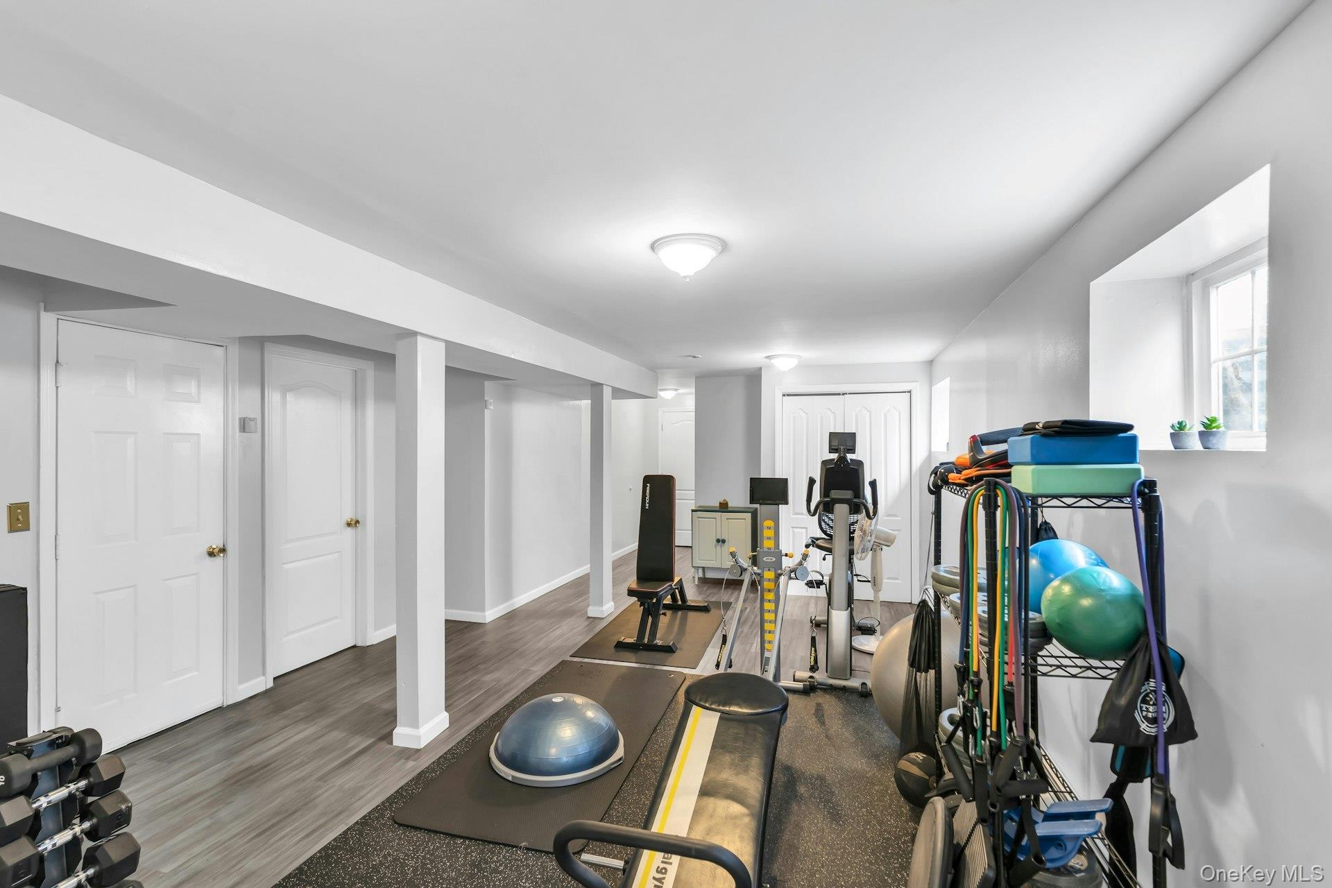 52 Edgewood Road Port Washington, NY 11050 - Photo 29 of 29 a view of a dining room with furniture and wooden floor