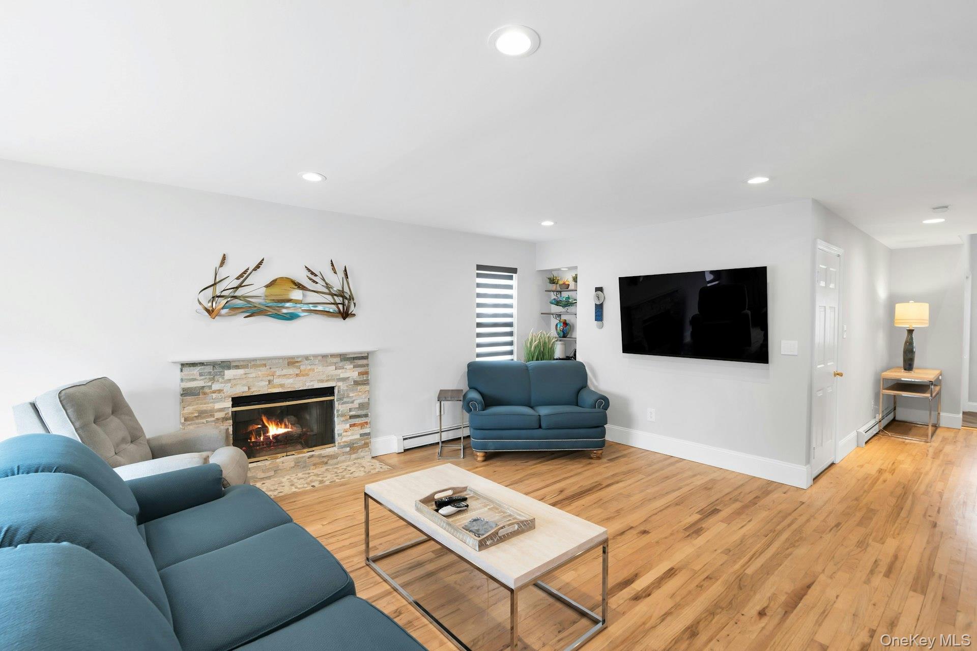52 Edgewood Road Port Washington, NY 11050 - Photo 8 of 29 a living room with furniture and a flat screen tv