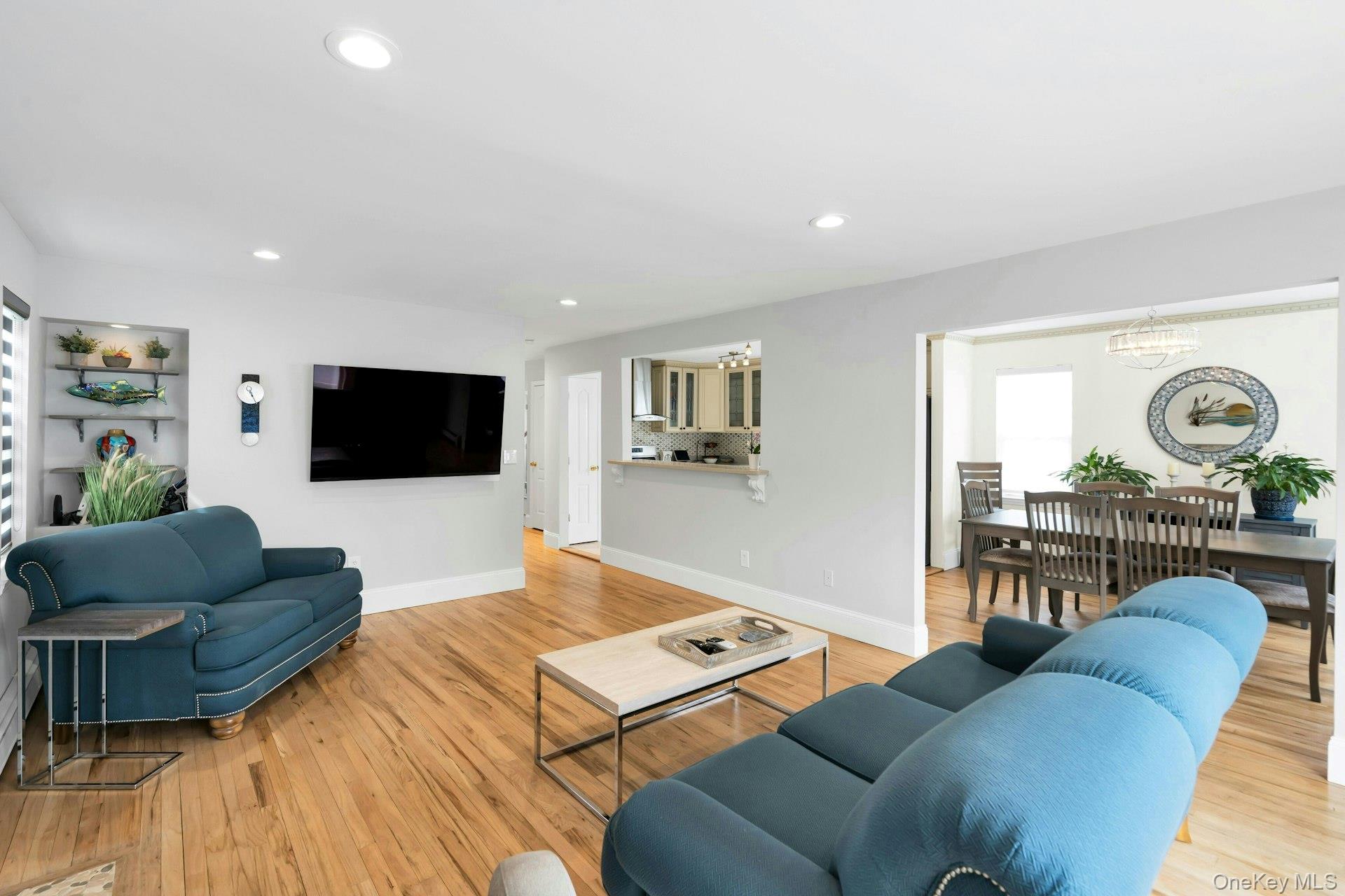 52 Edgewood Road Port Washington, NY 11050 - Photo 9 of 29 a living room with furniture and a flat screen tv
