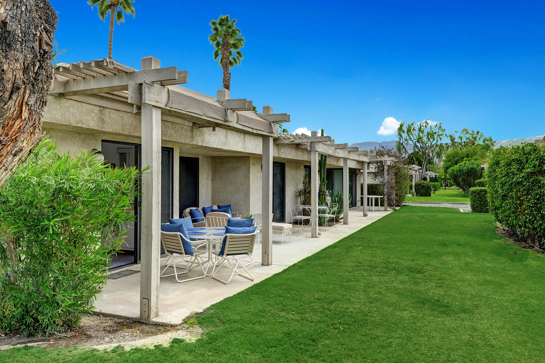 235 Vía Rengo Palm Desert, CA 92260 - Photo 14 of 16 BACK PATIO AND GREEN BELT RS