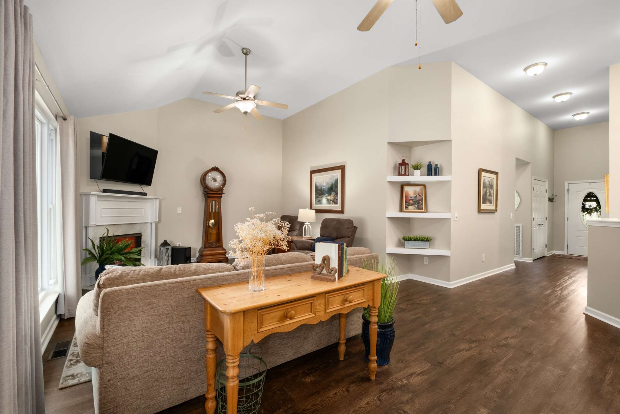 605 Windy Road Mount Juliet, TN 37122 - Photo 15 of 49 a living room with fireplace furniture and a flat screen tv
