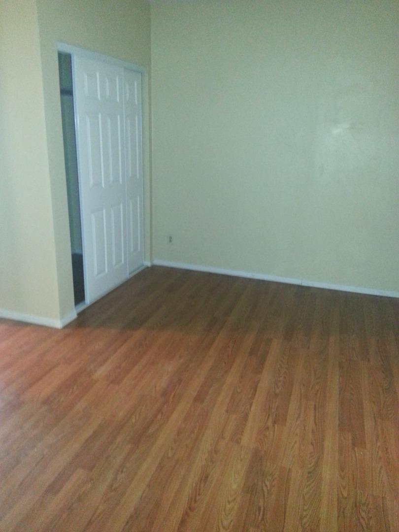 856 Modoc Street Merced, CA 95340 - Photo 11 of 16 an empty room with wooden floor