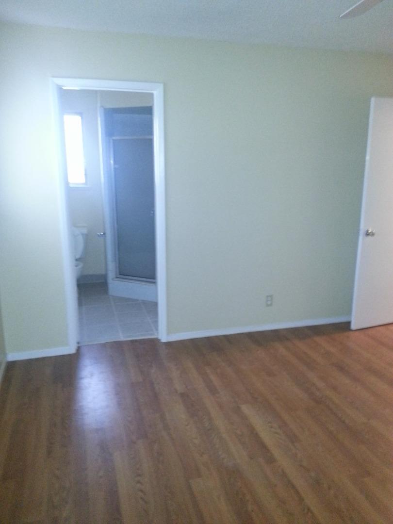 856 Modoc Street Merced, CA 95340 - Photo 13 of 16 an empty room with wooden floor and closet