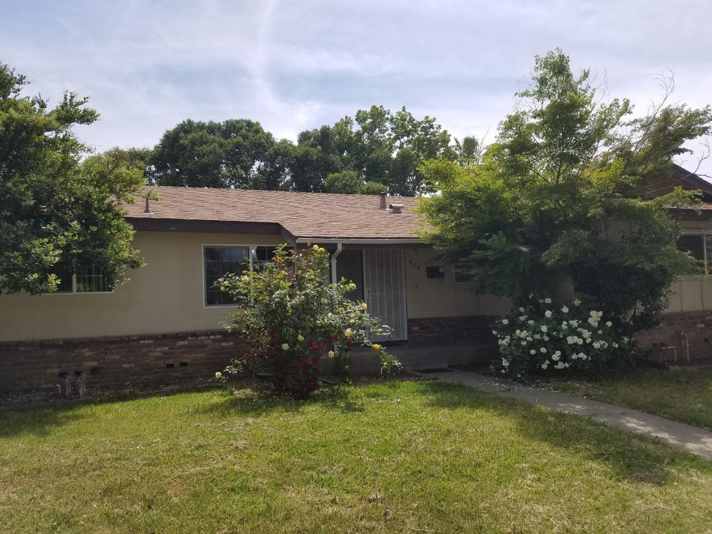 856 Modoc Street Merced, CA 95340 - Photo 2 of 16 a front view of a house with a yard