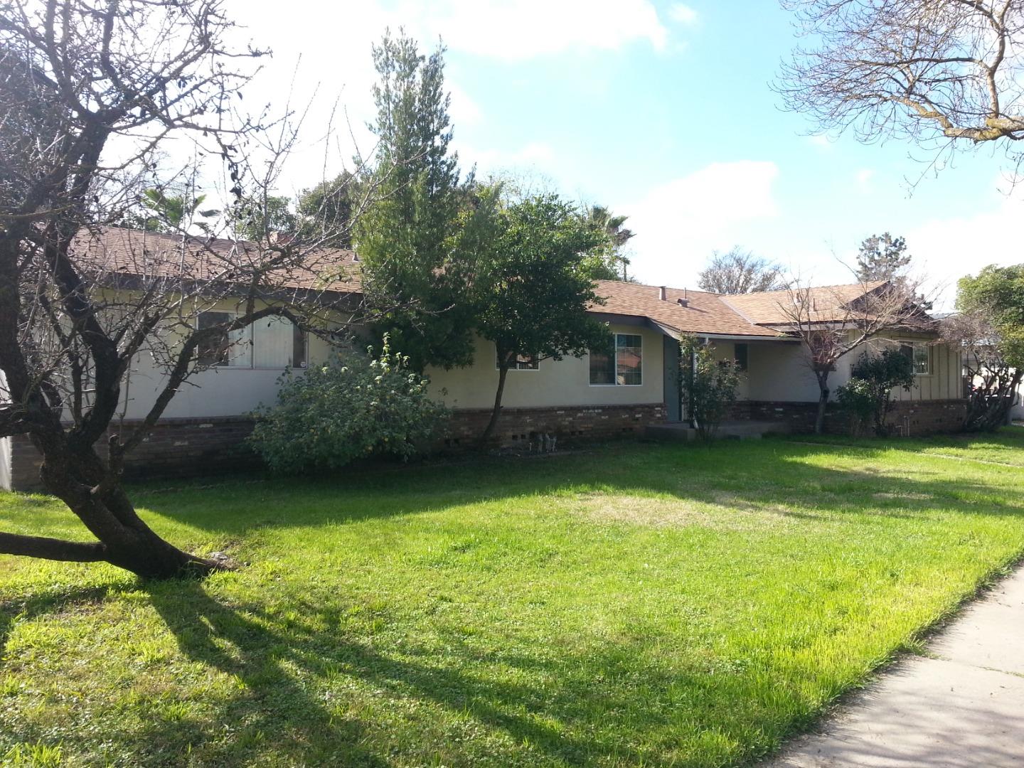 856 Modoc Street Merced, CA 95340 - Photo 3 of 16 a view of a house with pool and a yard
