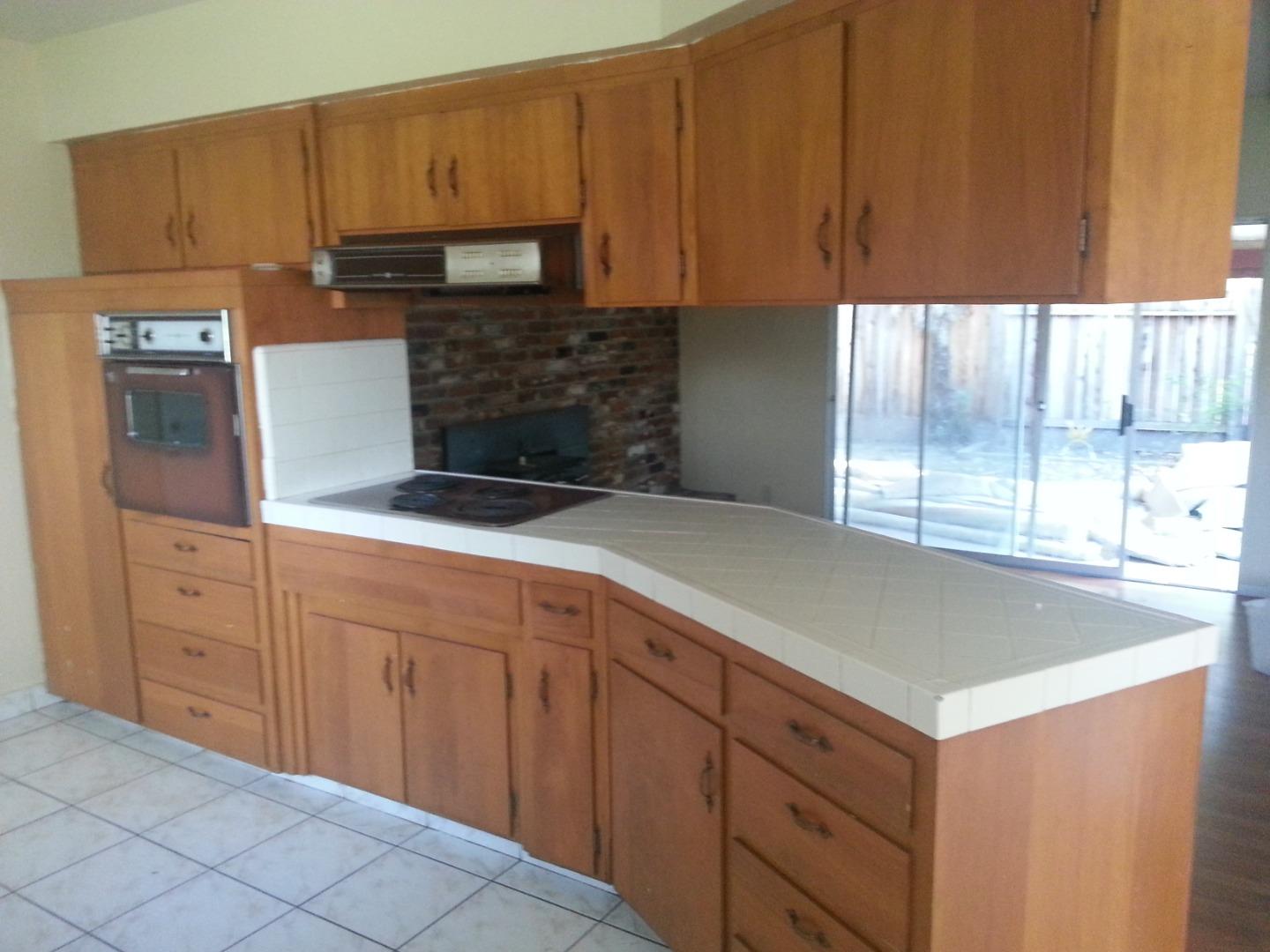 856 Modoc Street Merced, CA 95340 - Photo 6 of 16 a kitchen with granite countertop a sink and cabinets