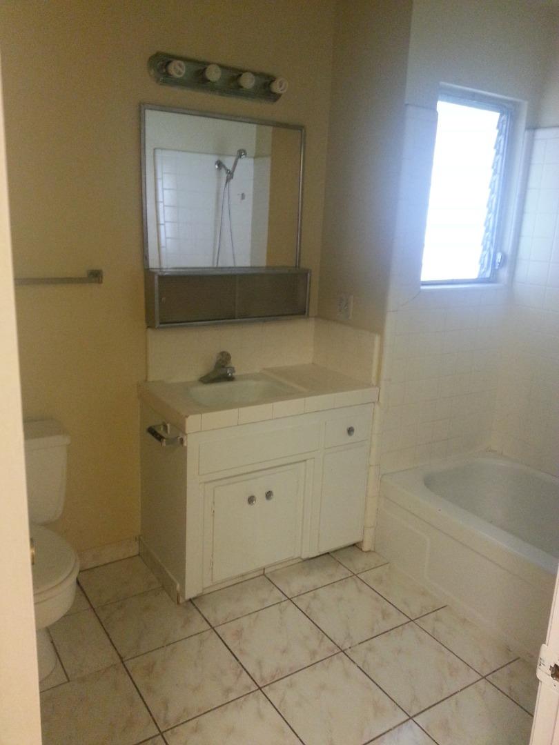 856 Modoc Street Merced, CA 95340 - Photo 9 of 16 a bathroom with a sink a vanity and a mirror