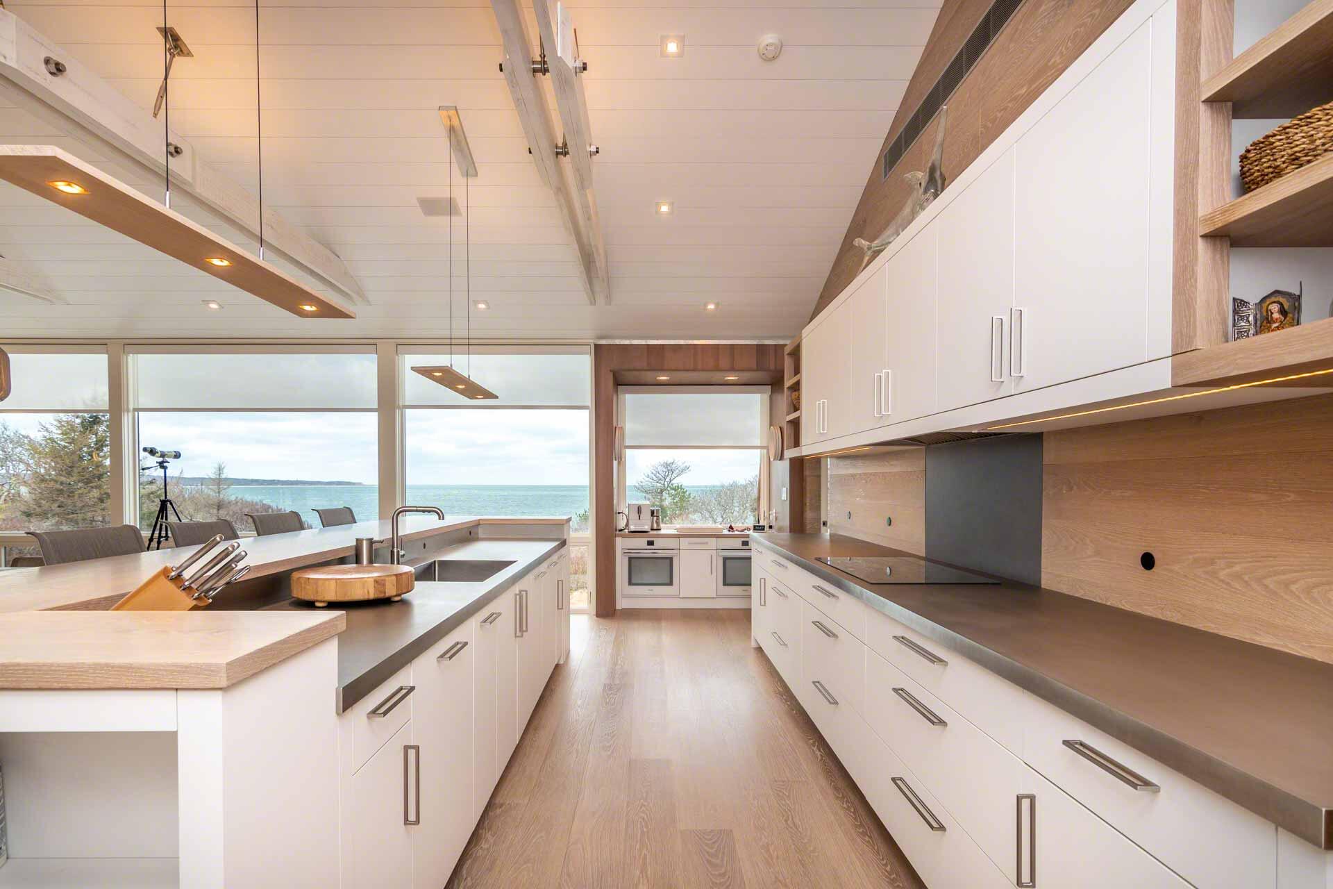 76 Menemsha Inn Road Chilmark, MA 02535 - Photo 12 of 39 a large white kitchen with lots of counter space