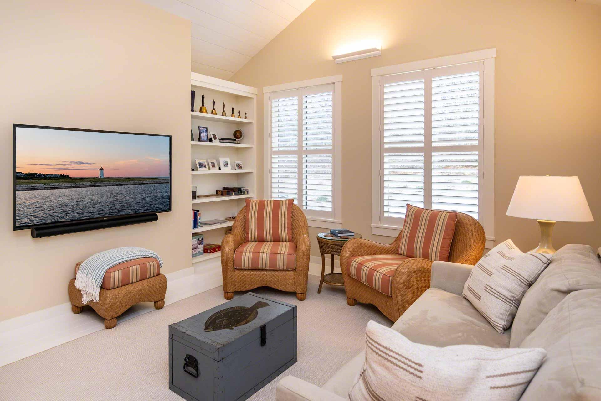 76 Menemsha Inn Road Chilmark, MA 02535 - Photo 16 of 39 a living room with furniture a flat screen tv and a window