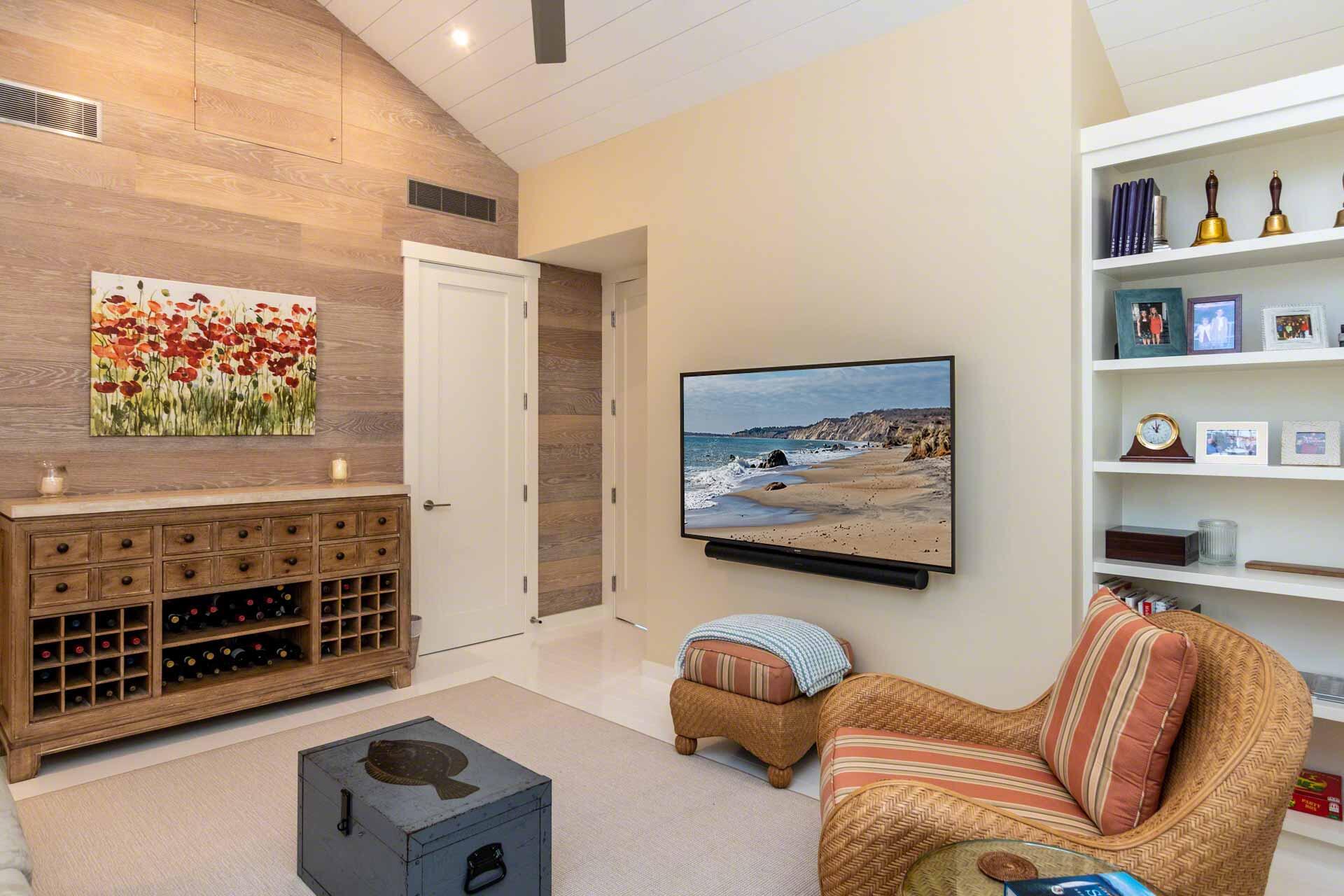 76 Menemsha Inn Road Chilmark, MA 02535 - Photo 17 of 39 a bedroom with furniture and a flat screen tv