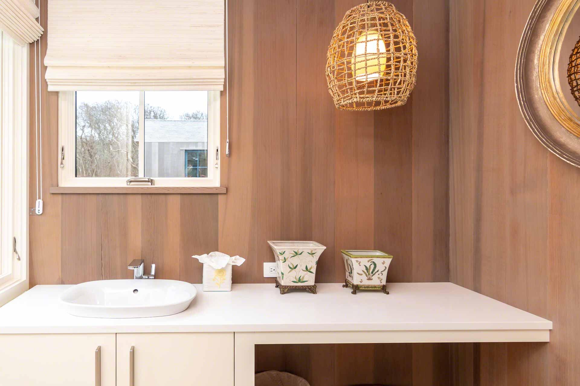 76 Menemsha Inn Road Chilmark, MA 02535 - Photo 25 of 39 a bathroom with a sink and a mirror