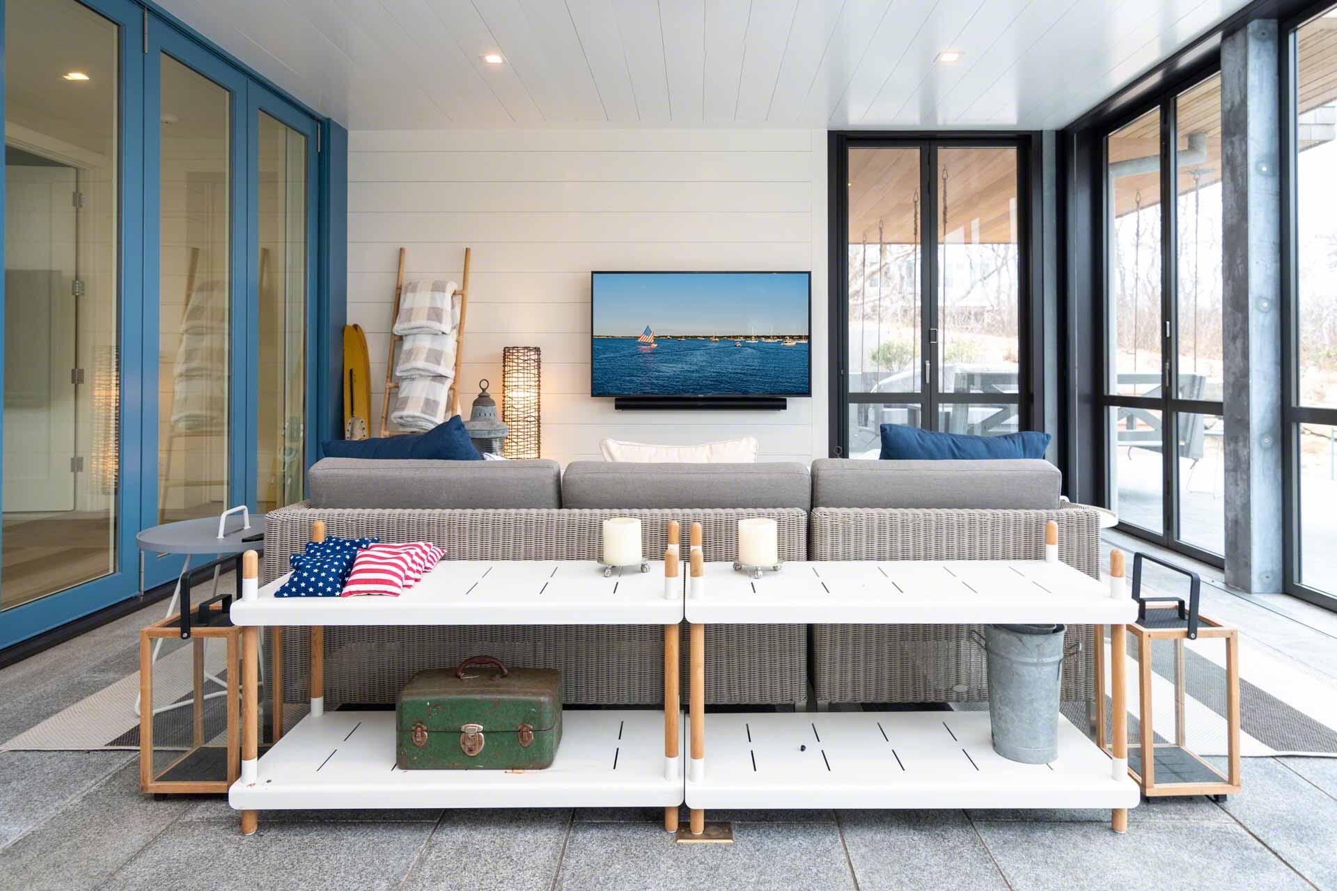 76 Menemsha Inn Road Chilmark, MA 02535 - Photo 28 of 39 a living room with furniture and a flat screen tv