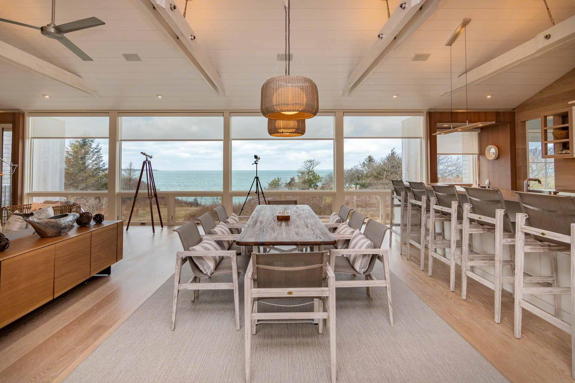 76 Menemsha Inn Road Chilmark, MA 02535 - Photo 8 of 39 a dining room with furniture a chandelier and a rug
