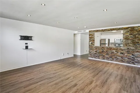a view of a livingroom with wooden floor