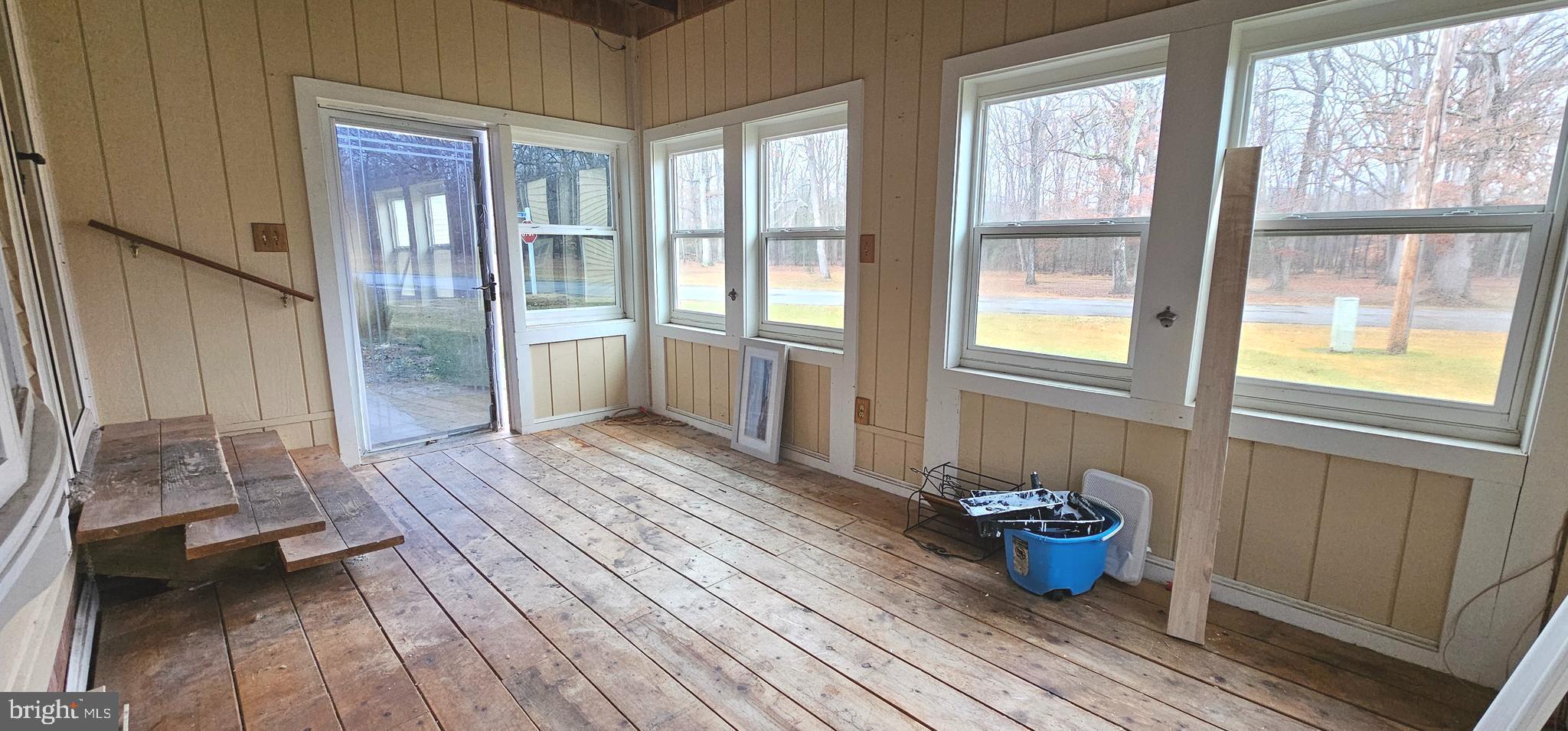 10505 Cedarville Road, Unit 21 Brandywine, MD 20613 - Photo 14 of 16 a view of a room that has a bed and wooden floor