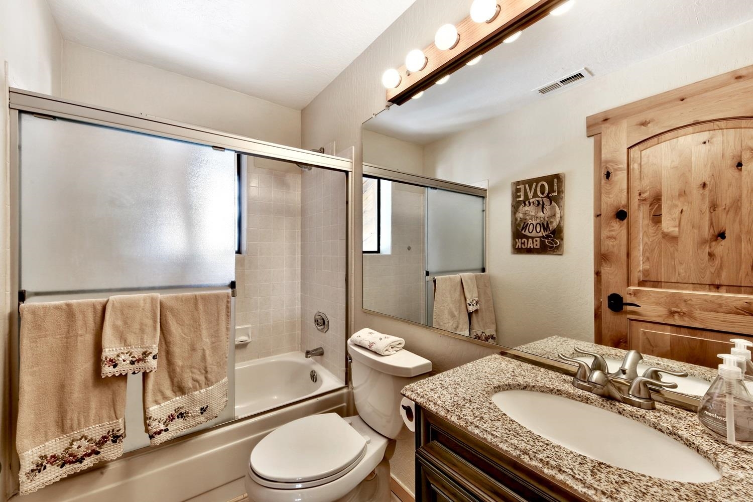 164 Basque Drive Truckee, CA 96161 - Photo 21 of 21 a bathroom with a granite countertop sink toilet and shower