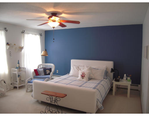 19 Schooner Ridge Marblehead, MA 01945 - Photo 11 of 19 a bedroom with a bed and a chandelier
