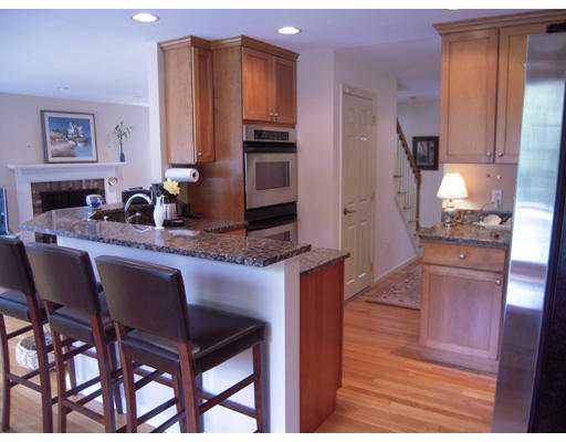 19 Schooner Ridge Marblehead, MA 01945 - Photo 6 of 19 a kitchen with a table chairs refrigerator and cabinets