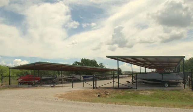 a terrace with outdoor seating and barbeque oven