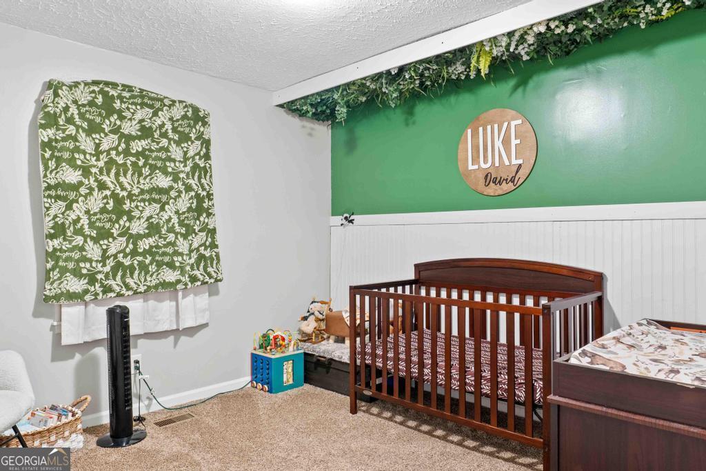 1881 Timberlane Road Milledgeville, GA 31061 - Photo 19 of 28 a bedroom with a bed and window