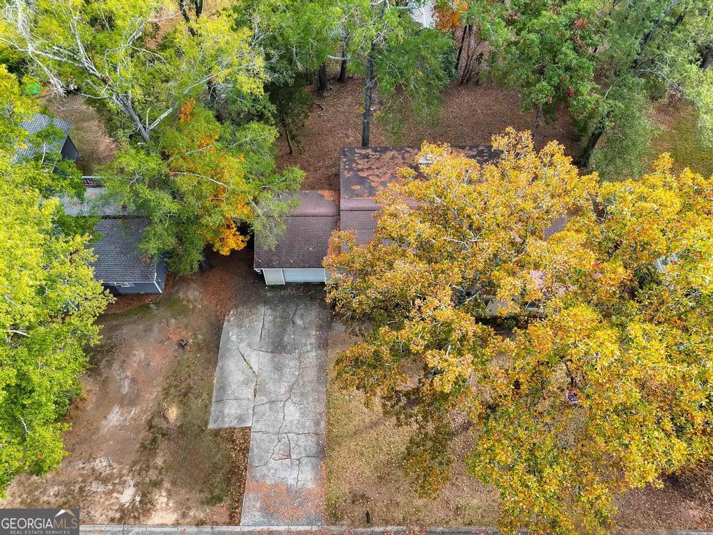 1881 Timberlane Road Milledgeville, GA 31061 - Photo 22 of 28 a backyard of a house with lots of green space and lake view