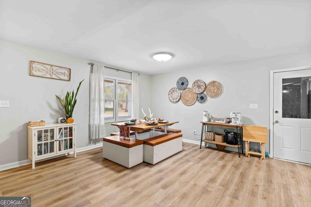 1881 Timberlane Road Milledgeville, GA 31061 - Photo 7 of 28 a living room with furniture and wooden floor