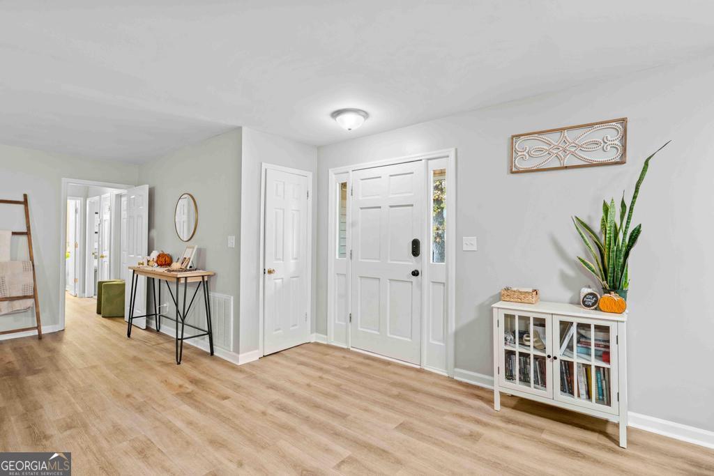 1881 Timberlane Road Milledgeville, GA 31061 - Photo 8 of 28 a bedroom with furniture and wooden floor