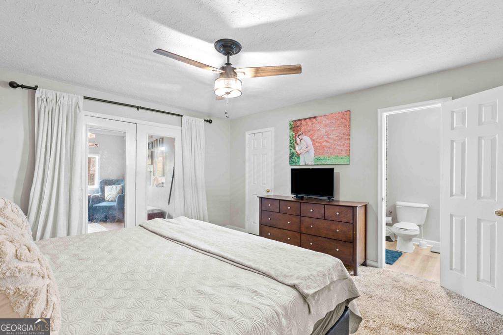 1881 Timberlane Road Milledgeville, GA 31061 - Photo 10 of 28 a bedroom with a bed and a flat screen tv