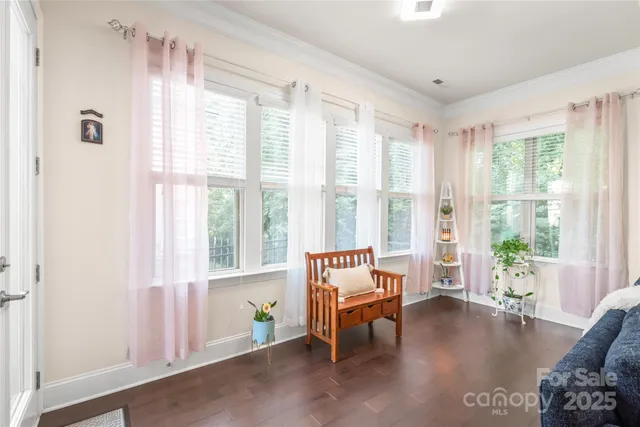 a view of a livingroom with furniture and a window