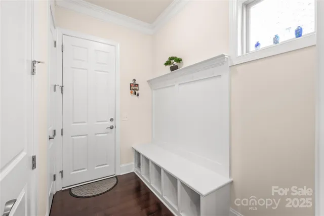 a bathroom with a toilet a sink and a mirror